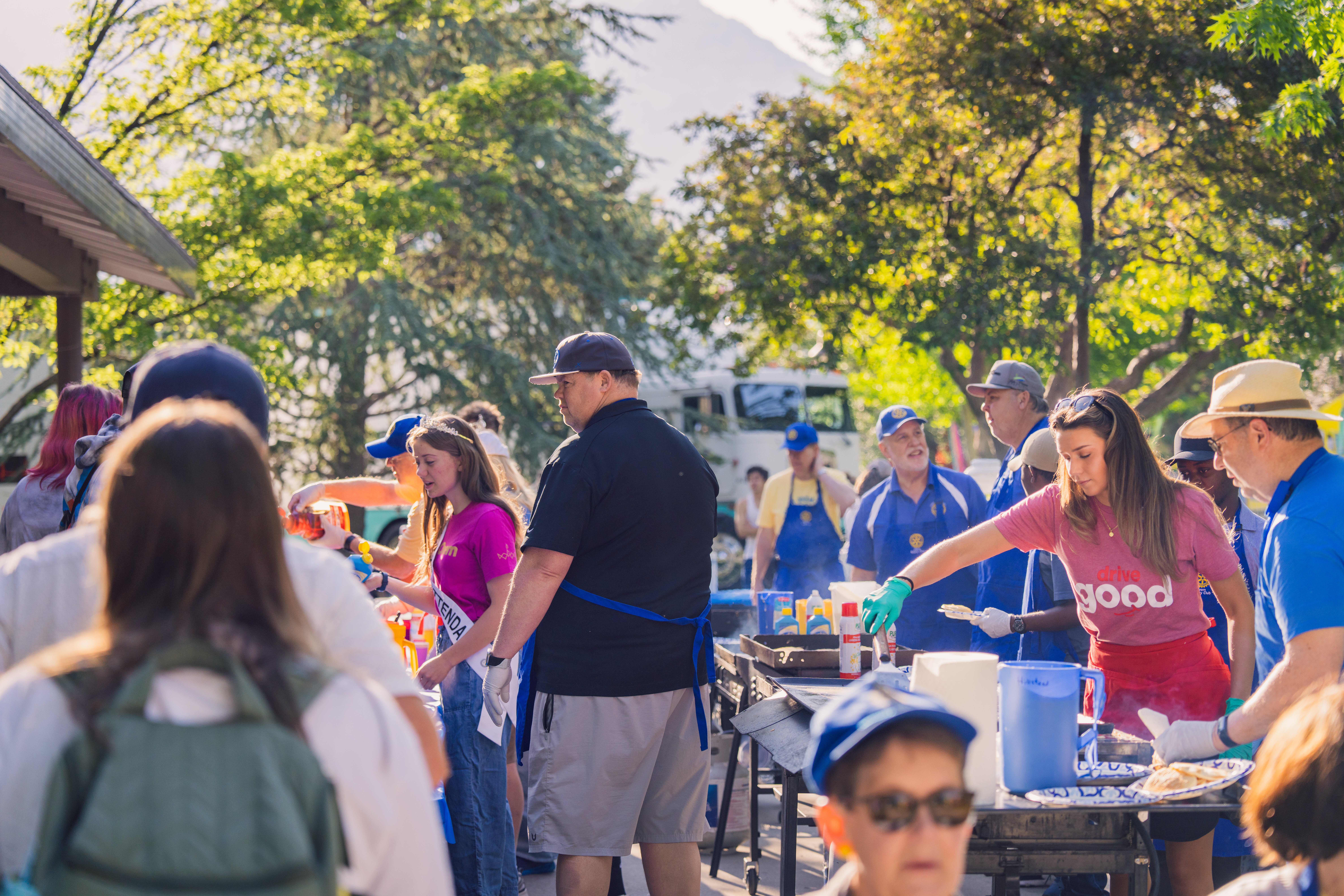 People talking at the Rotary Club Pancake Breakfast event.